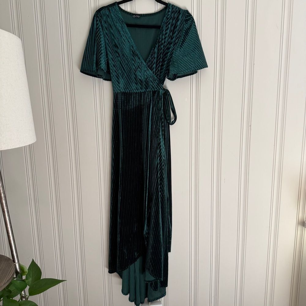 Simplee Apparel Dark Green High-Low Wrap Dress with Flutter Sleeves in Velvet